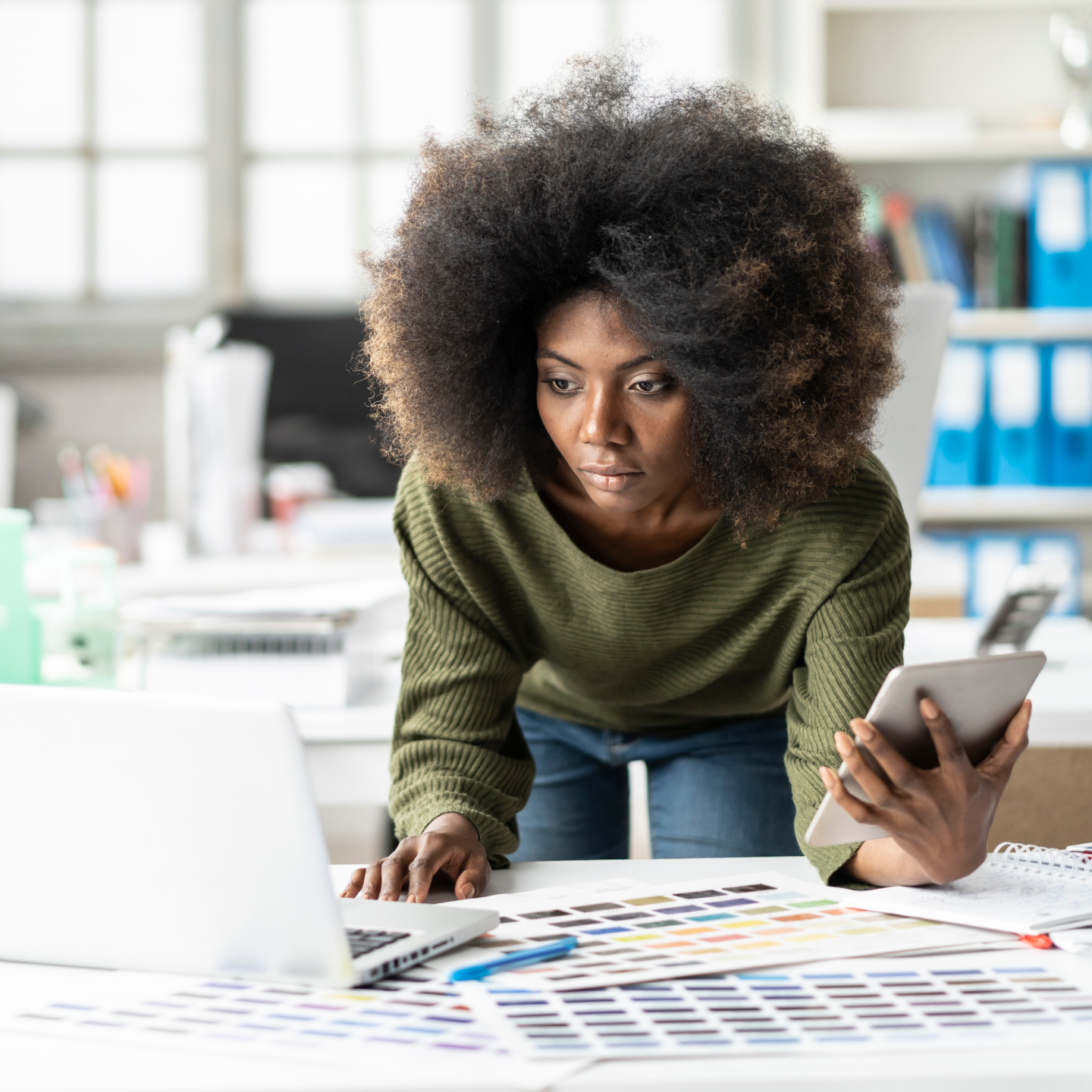 A person planning how to protect their files from a cyber attack by backing them up online.