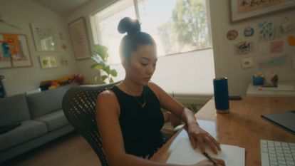 Illustrator and designer Sophia Chang working at her computer