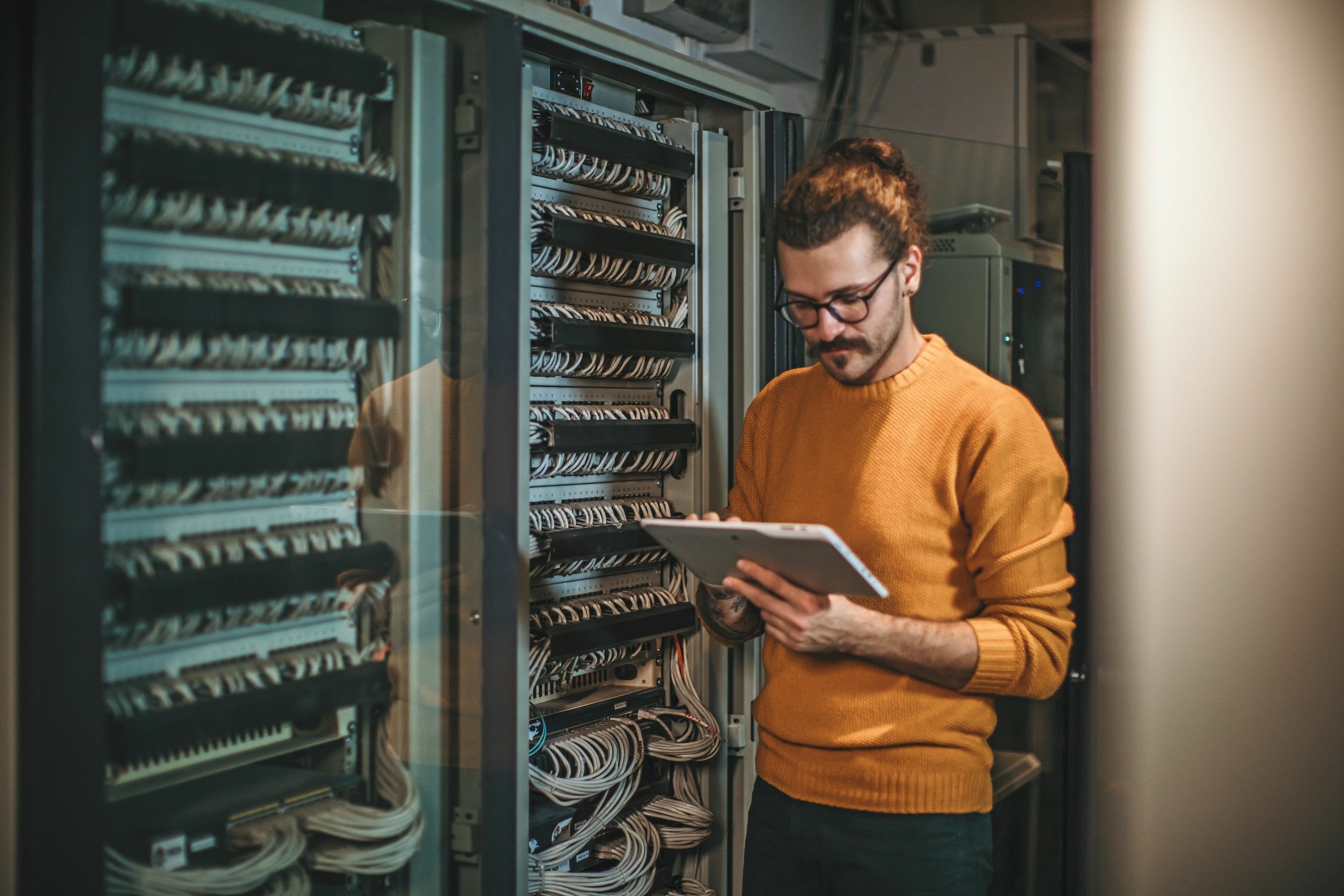 An engineer works on a server