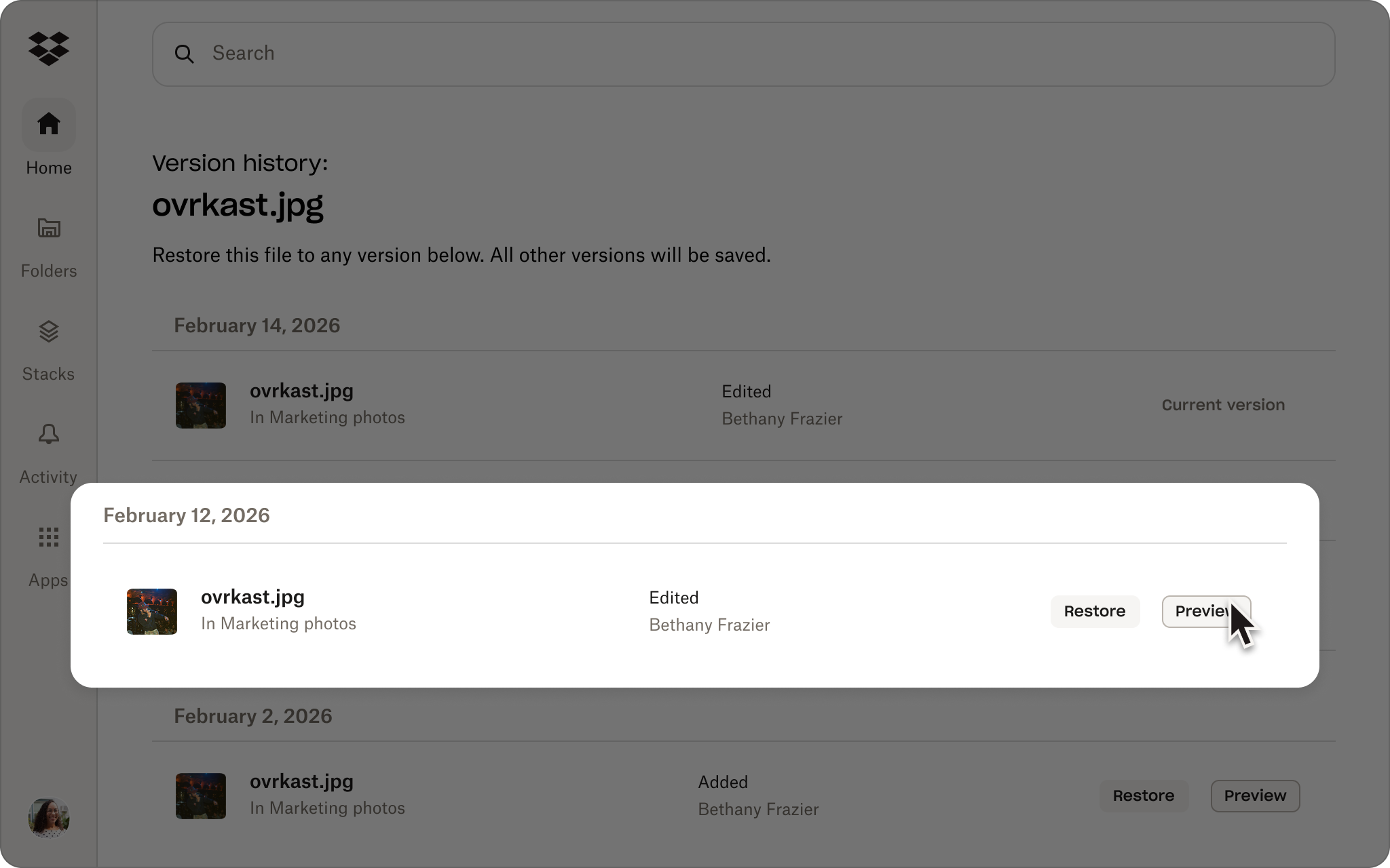 Screenshot of Dropbox version history for “ovrkast.jpg,” showing versions from February 14, February 12, and February 2, 2026.