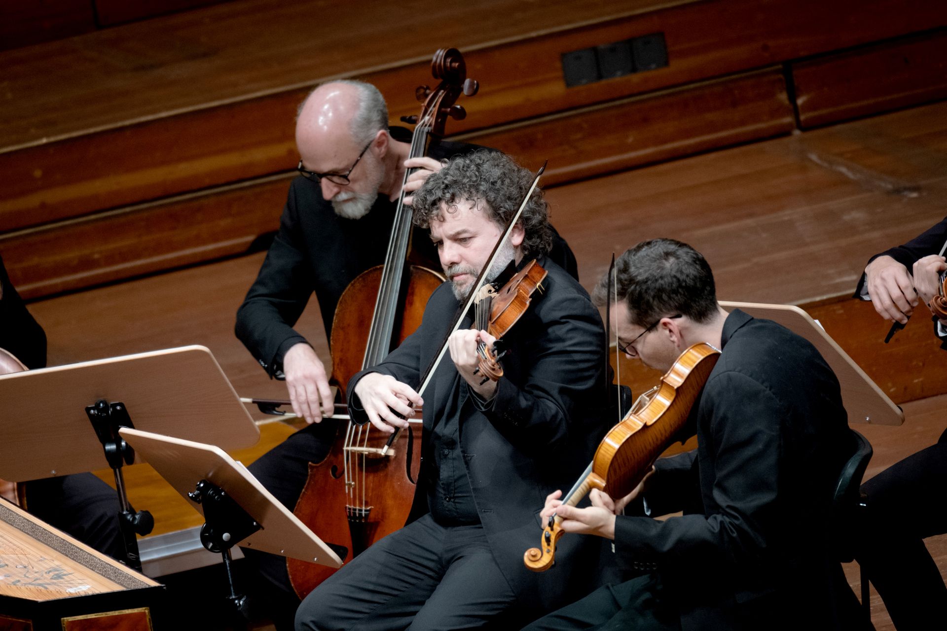Three men playing stringed instruments
