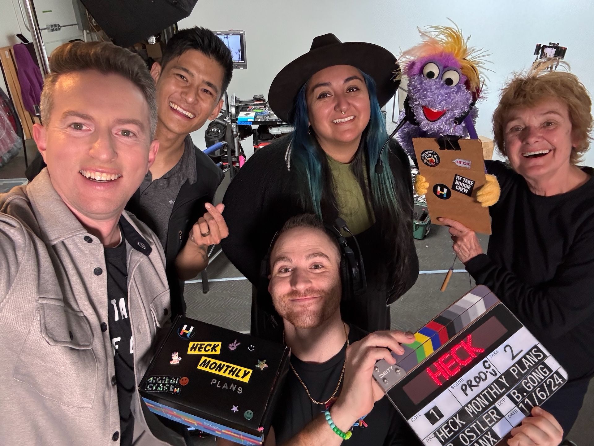 Heck crew with a muppet and a video clap board