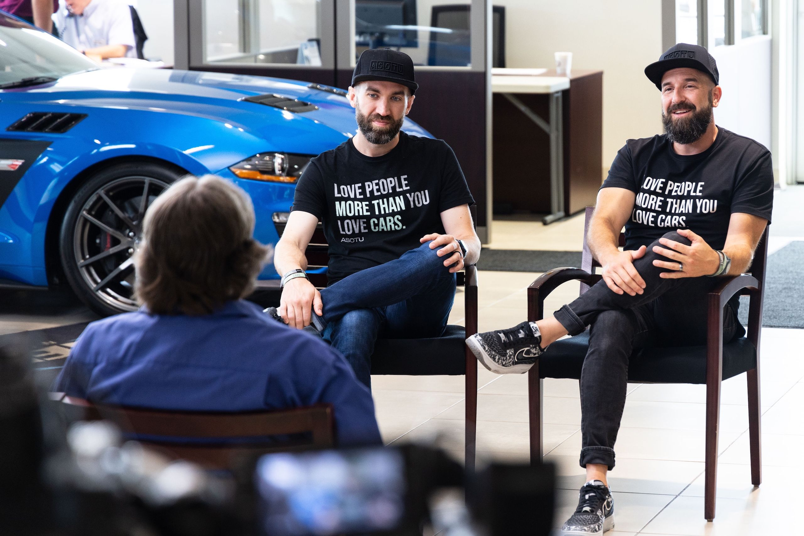 Kyle Mountsier and Paul J Daly conducting an interview in a dealership