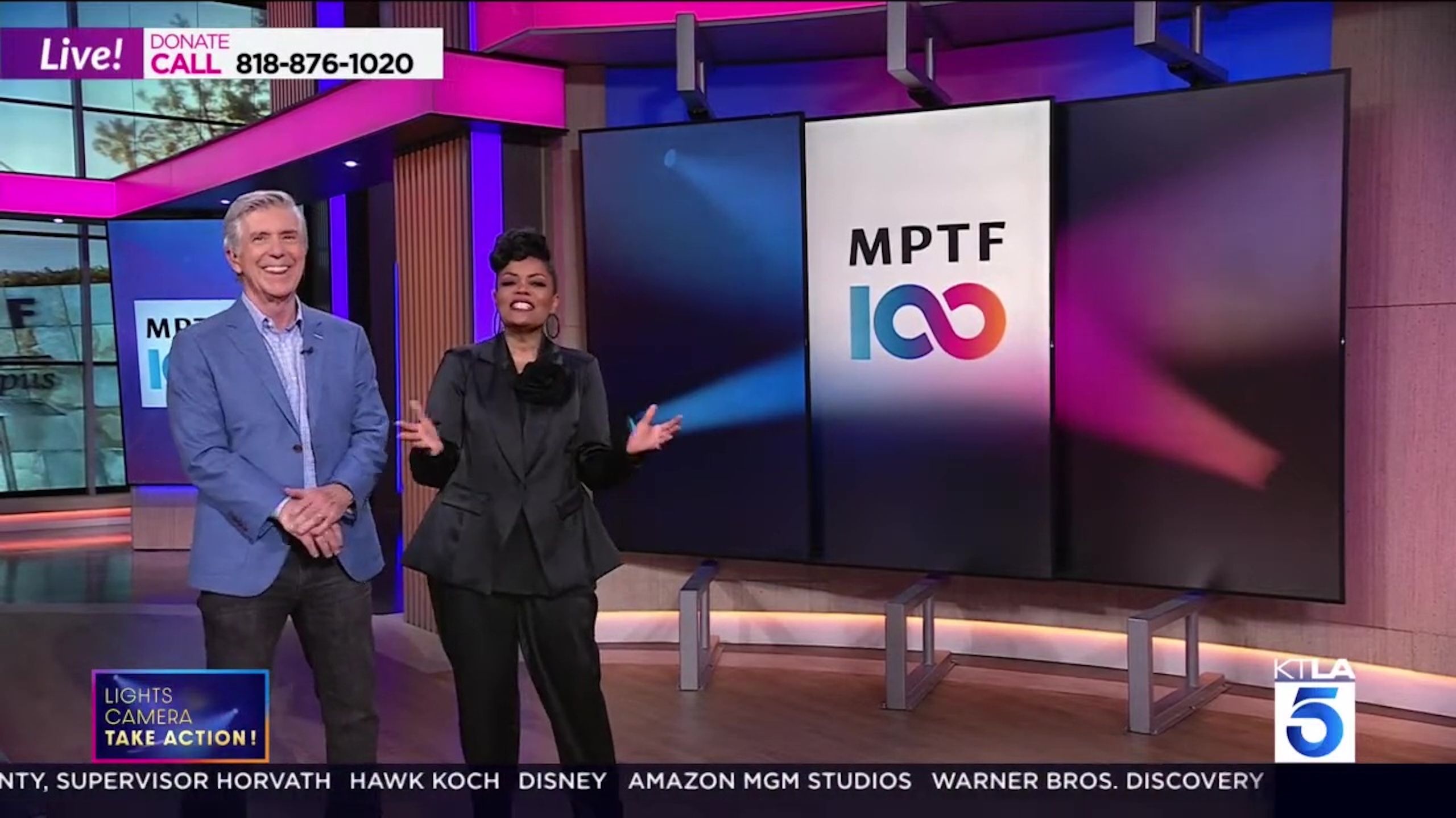 Male and female talking on a TV station