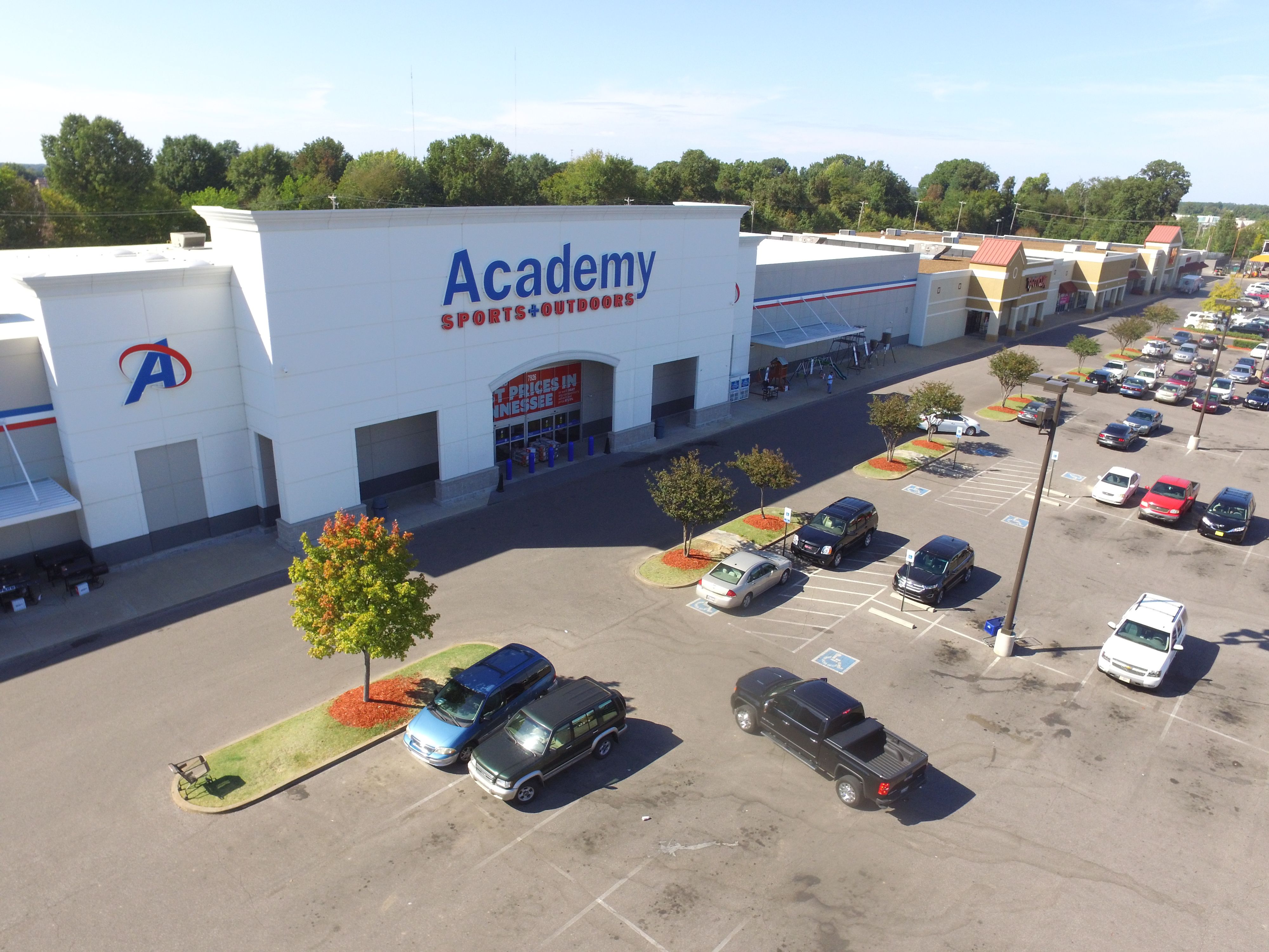 exterior view of academy, sports and outdoors shop with car park