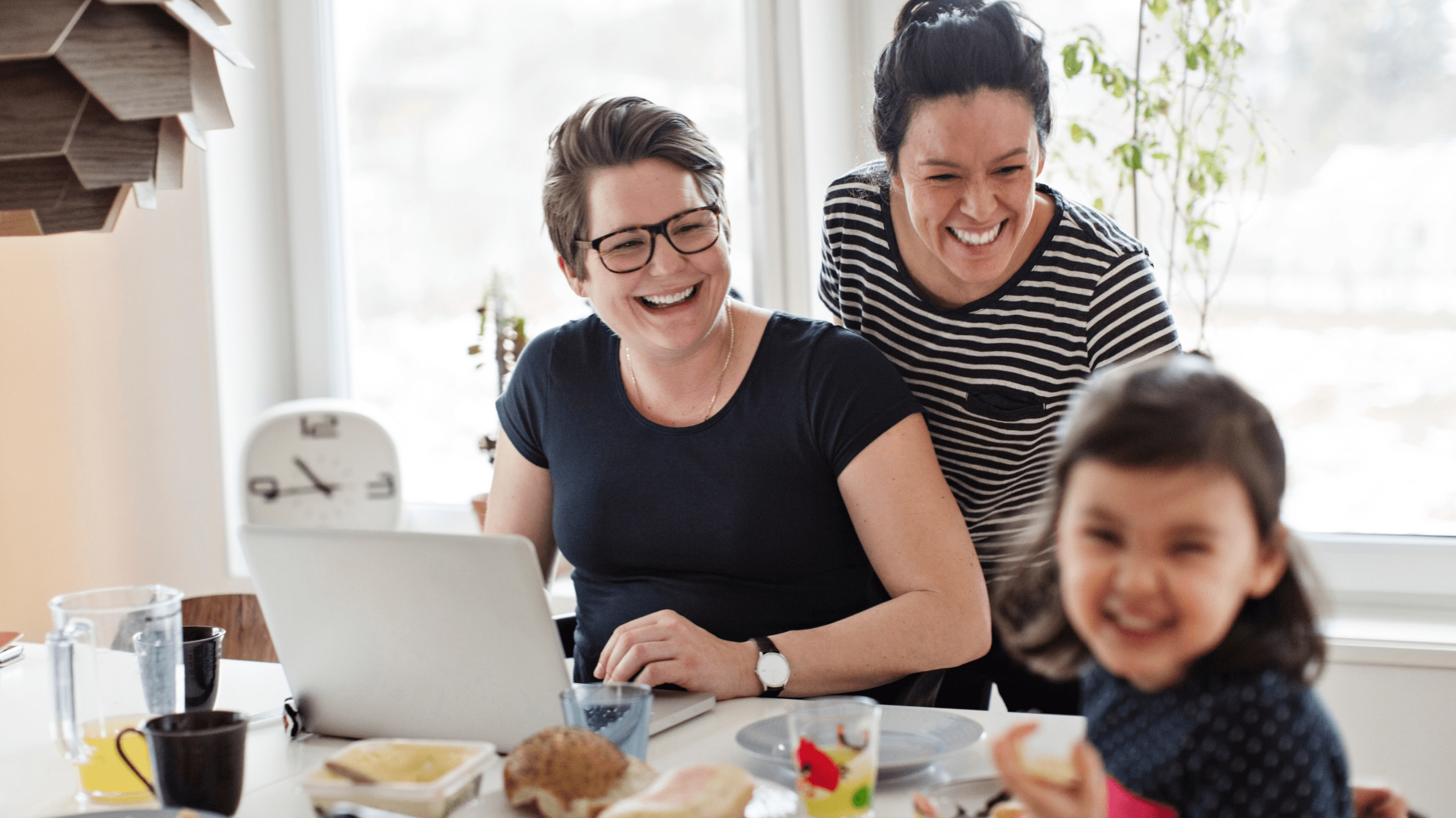 Image of a family at a computer