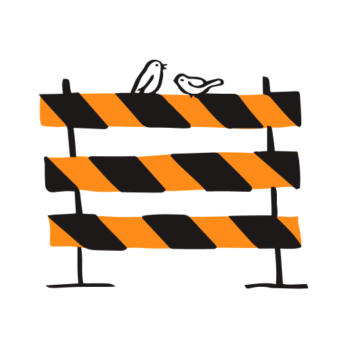 A black and orange road barrier.