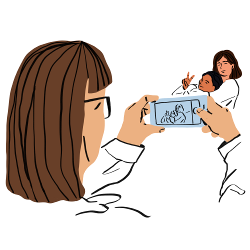 A person holds a smartphone horizontally to take a photo of a parent and child.