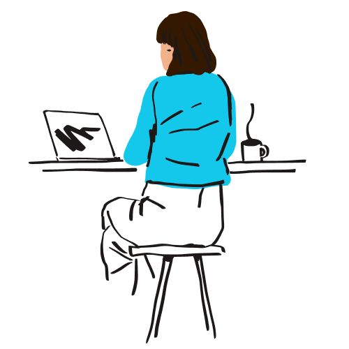 A person sits on a stool and works on their laptop.