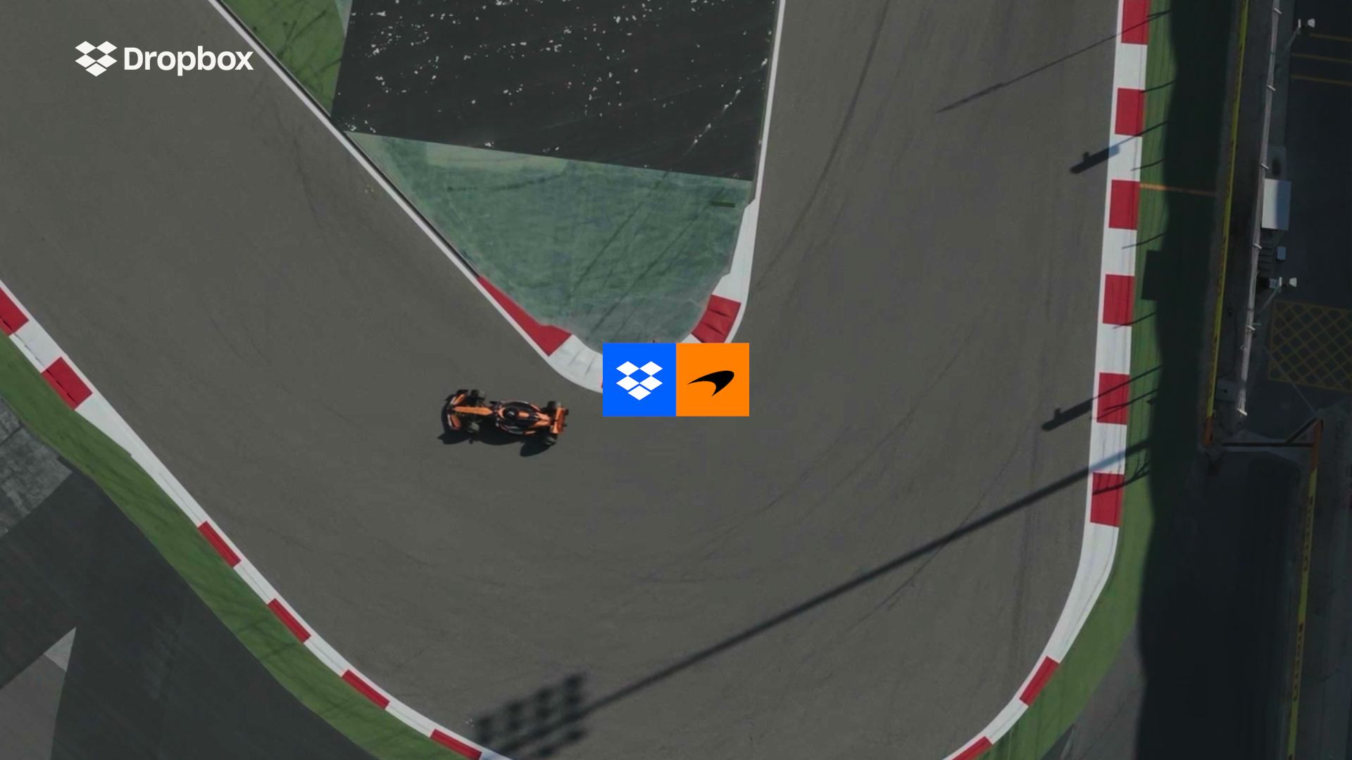An image showing a McLaren car turning a corner with an overlayed image with McLaren and Dropbox Logos