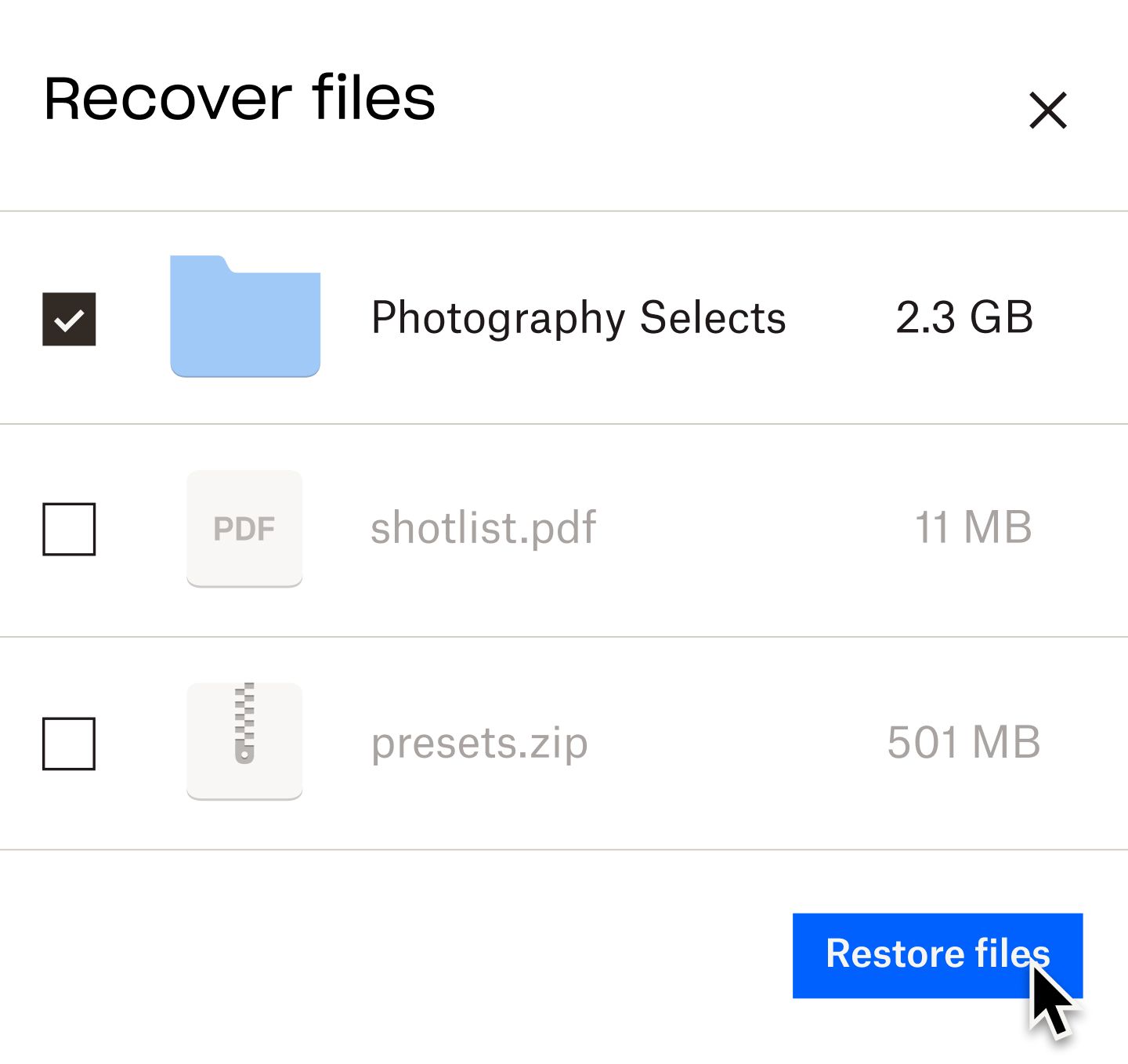 A user clicking on a blue “retore files” button to recover a file labeled “photography selects”