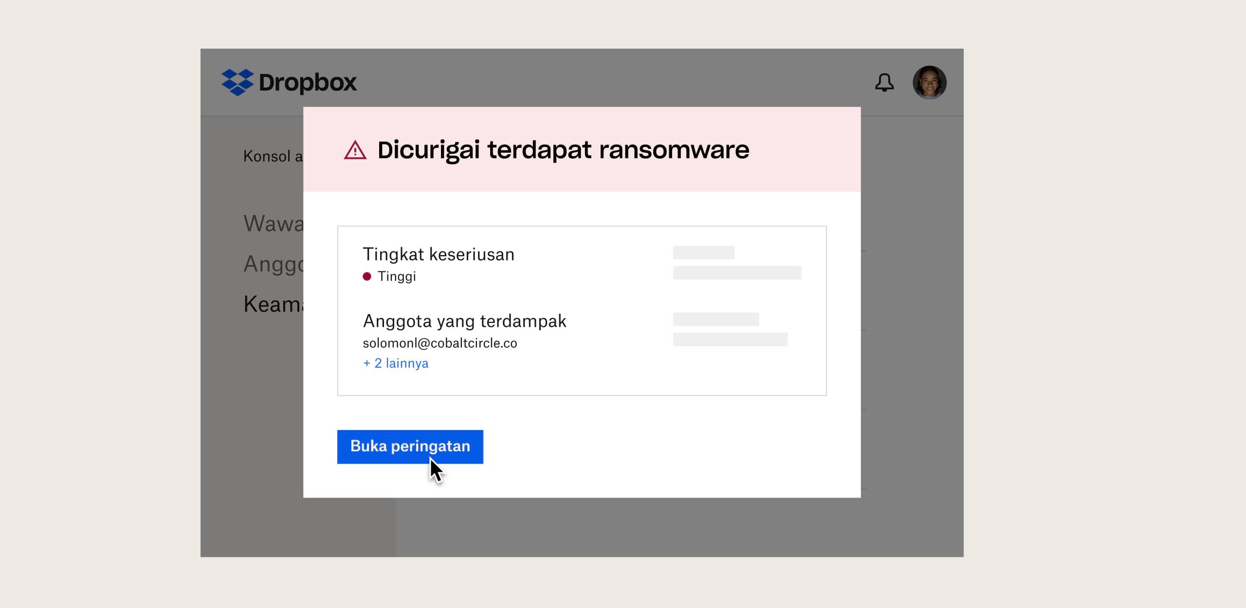Seorang pengguna melihat peringatan keamanan yang mencurigai aplikasi penipuan (ransomware) di Dropbox