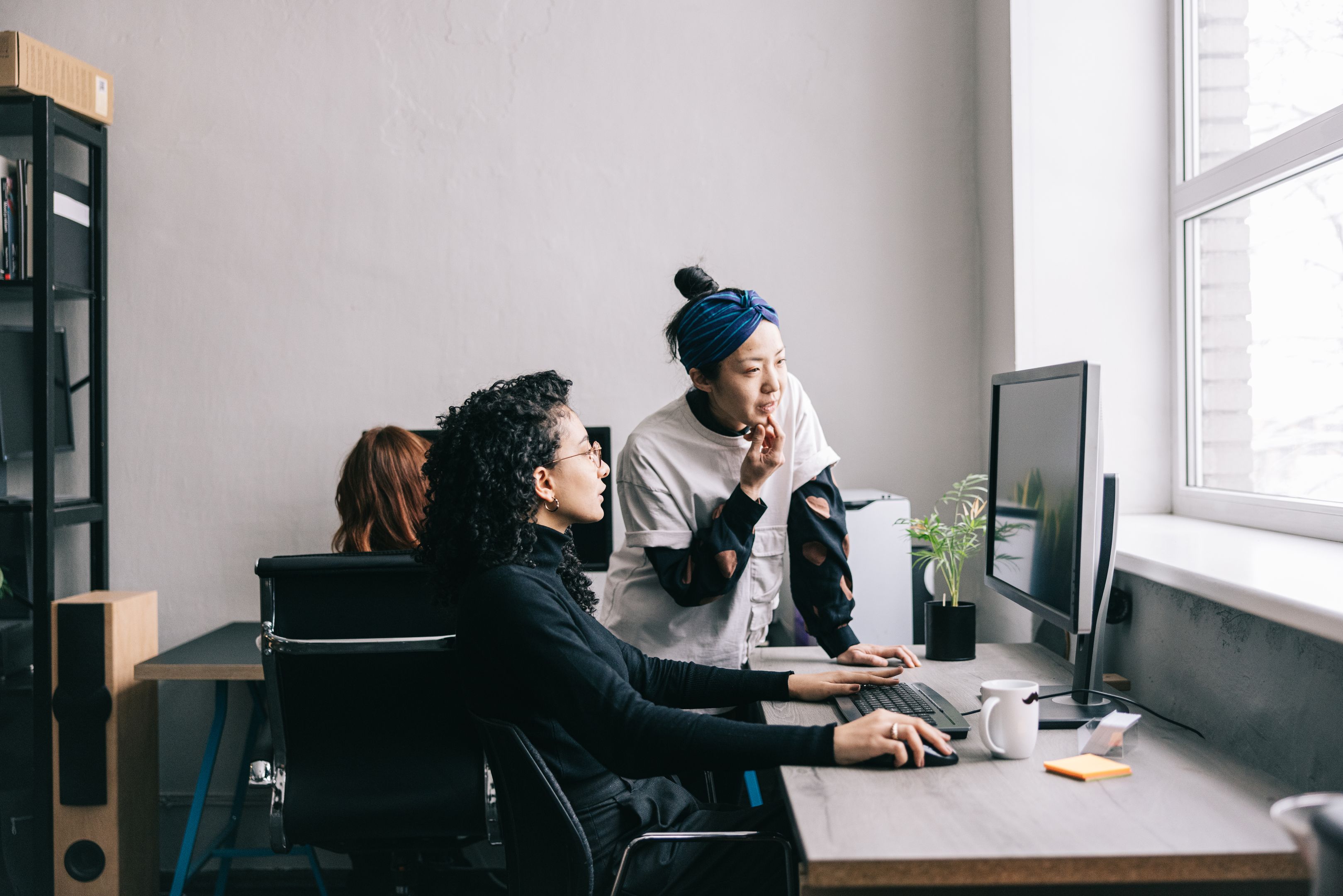 A creative team find campaign assets without switching between tools on a desktop PC.