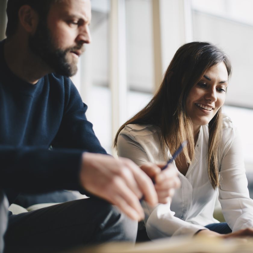 Two professionals sign a sales contract online.