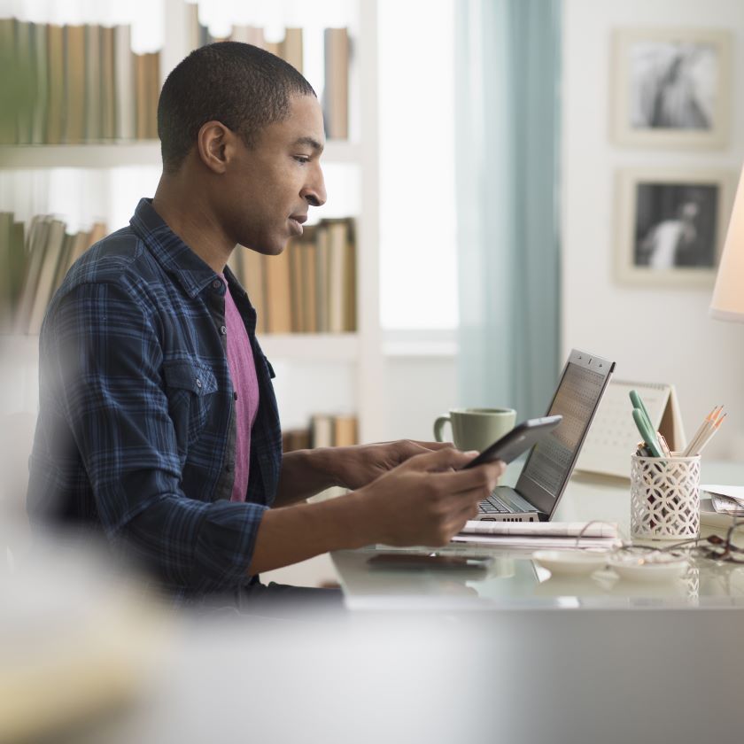 A remote worker uses Dropbox to share files with colleagues.
