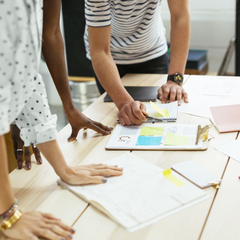 A team collaborates on a project and a shared workspace.
