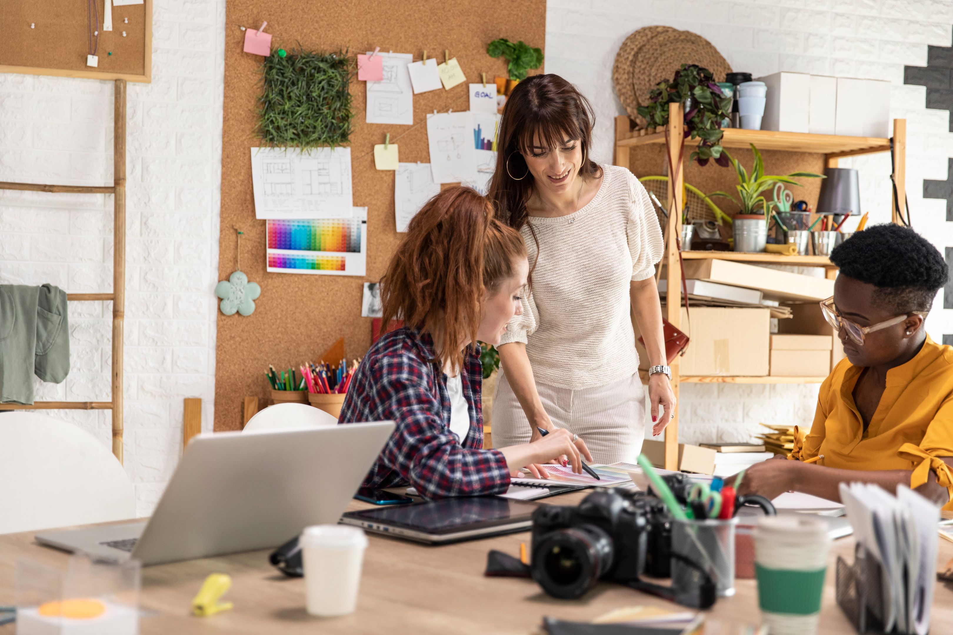 A creative team review design files together.