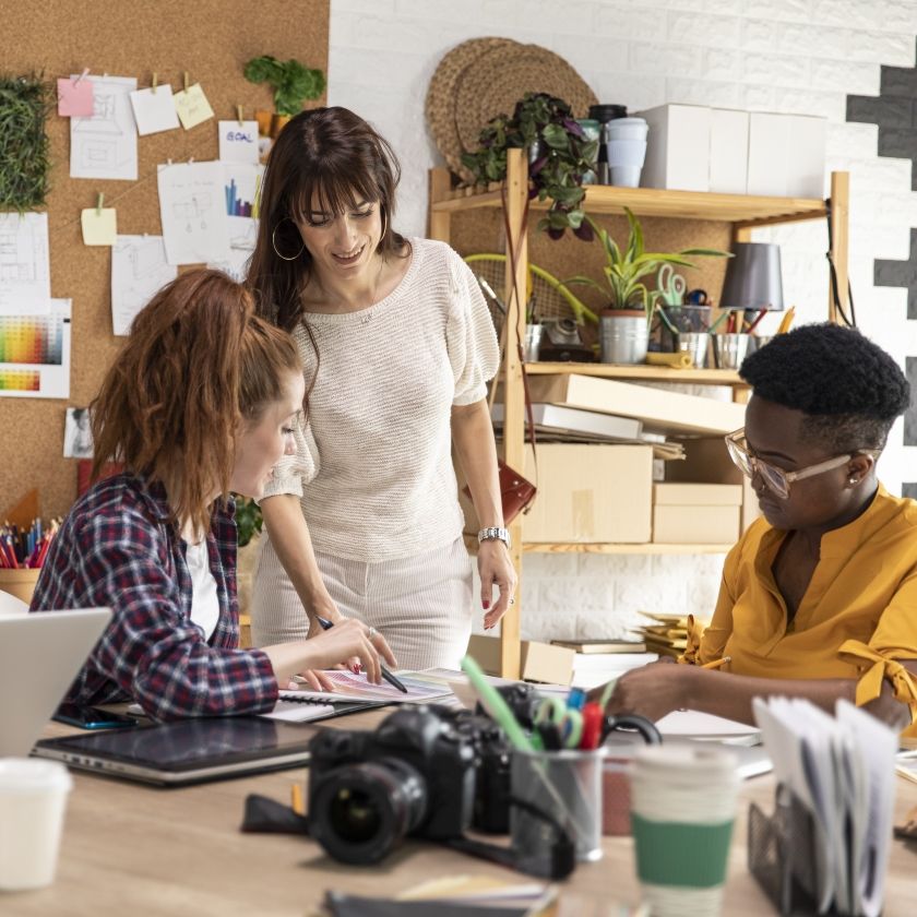 A creative team review design files together.