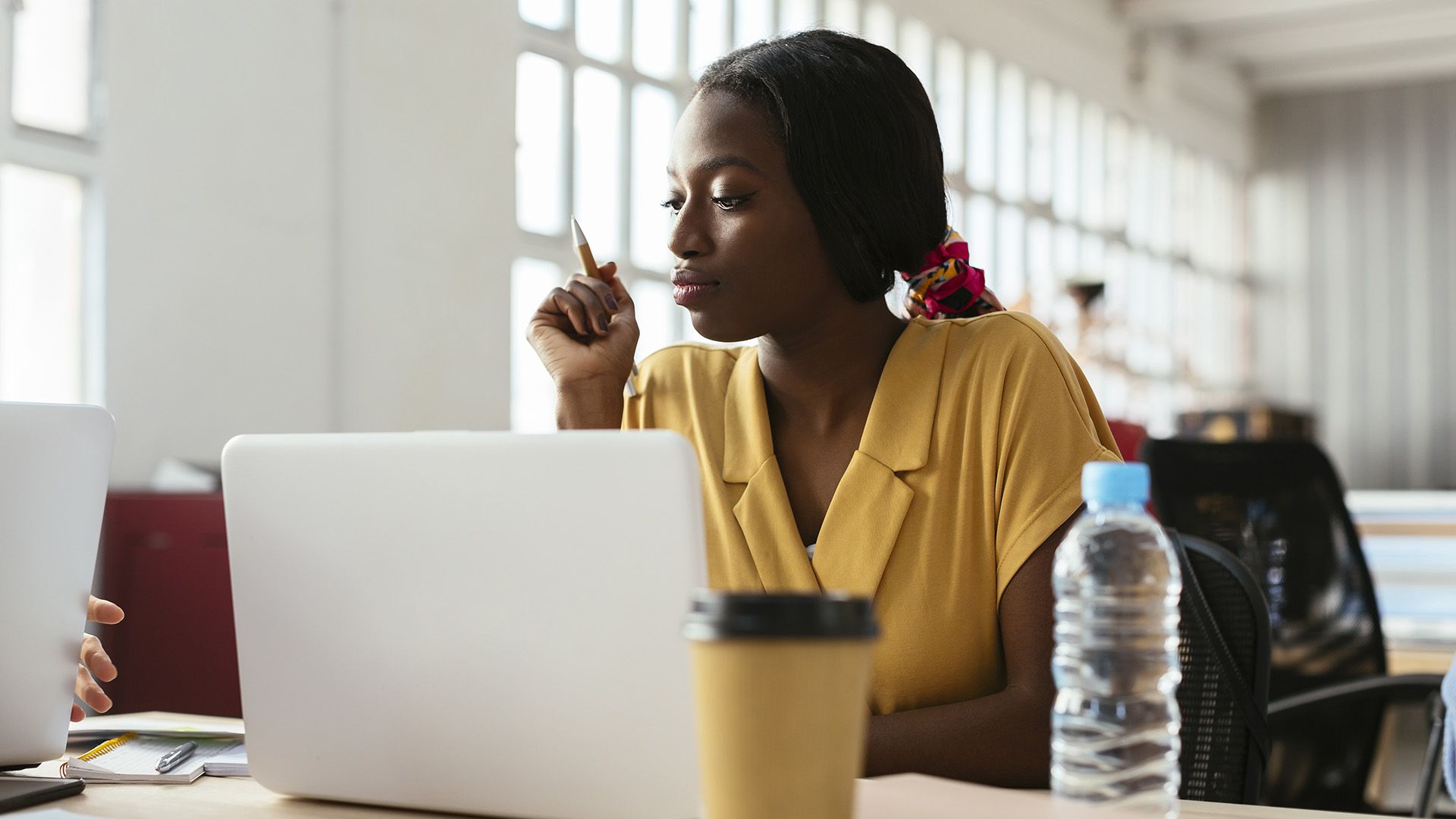 A person accesses their AI cloud storage from a laptop while working from home.