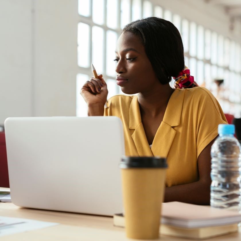 A person accesses their AI cloud storage from a laptop while working from home.