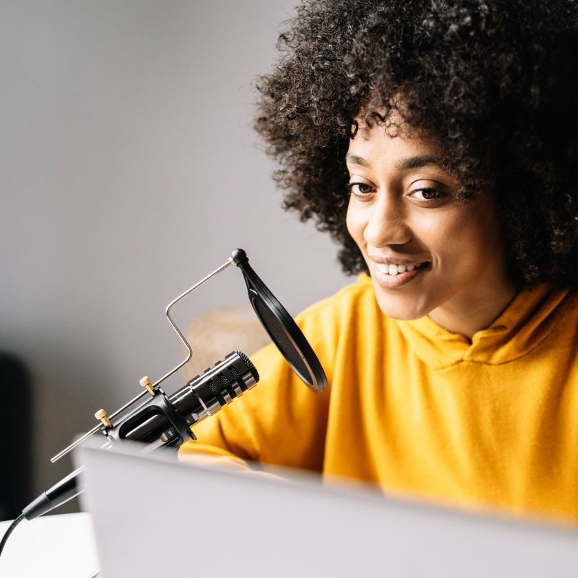 A person records their speech for a video voiceover and converts it to text.