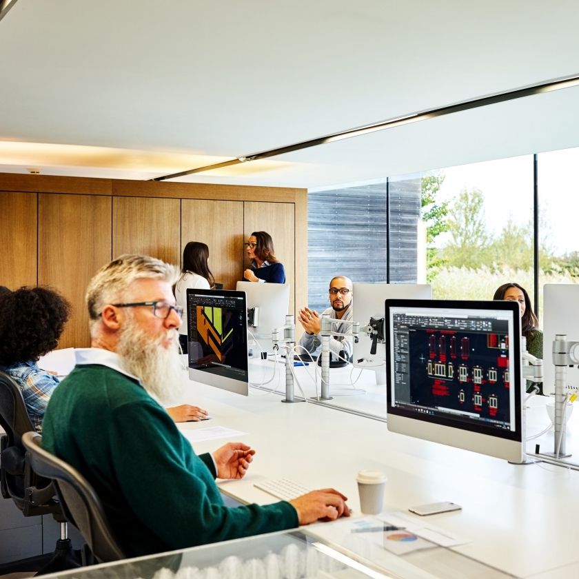 A team works securely across cloud storage in an office environment.