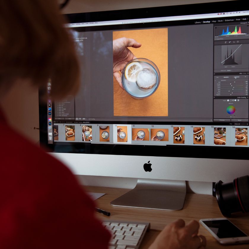 A person working with image files on their computer.