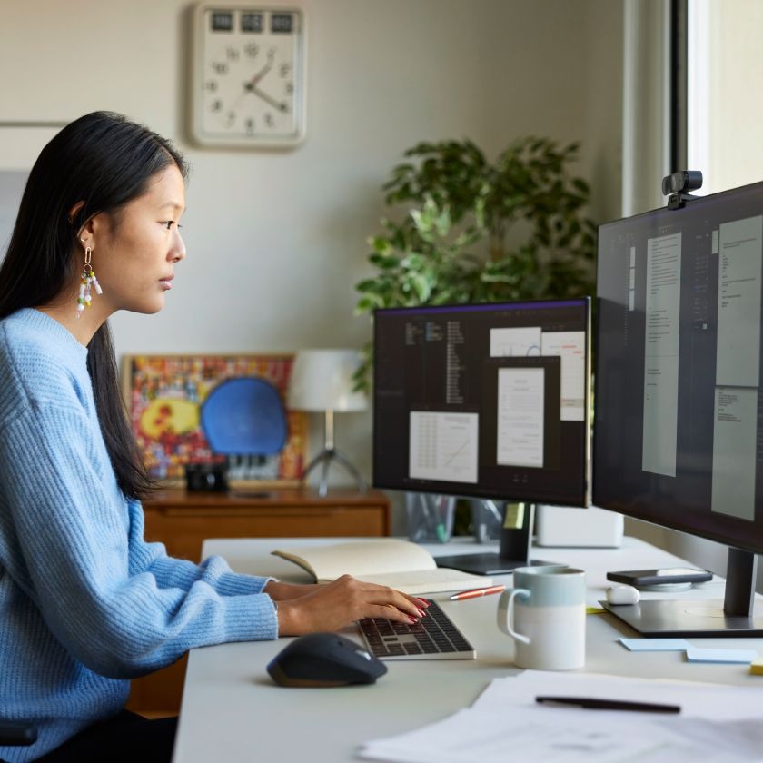 A person working in their home office edits a PDF on their desktop computer.