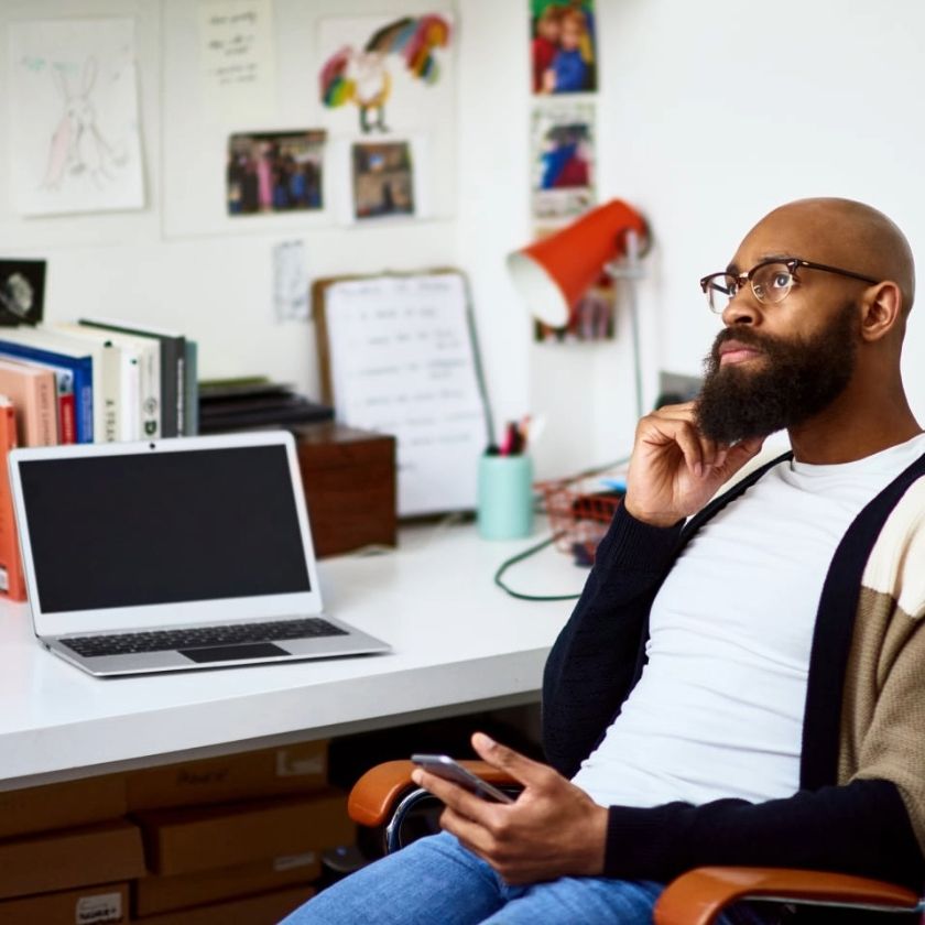 A person sits at their desk, wondering how they can recover files for a deleted user account.