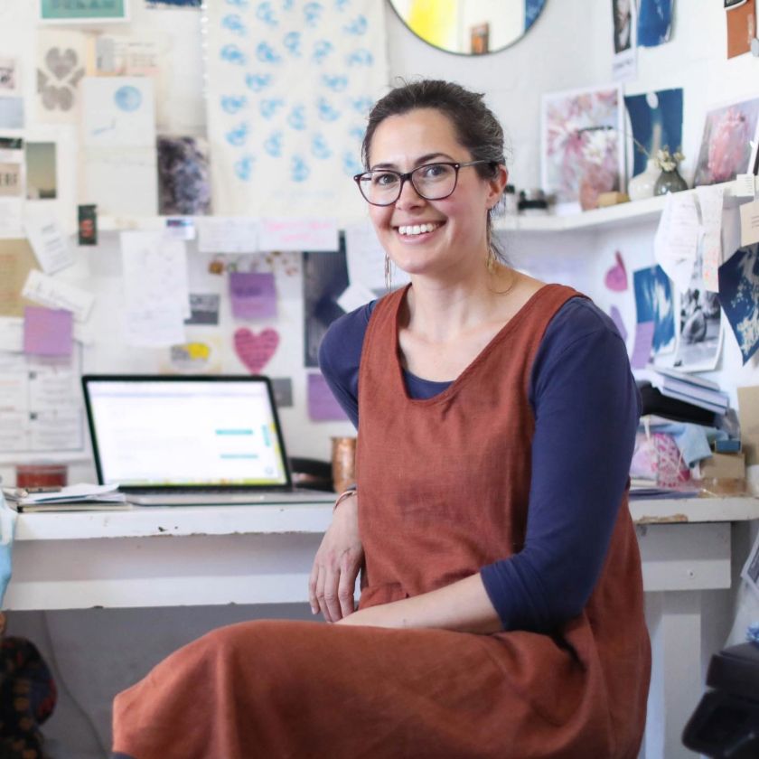 A solopreneur running their small online business from their home office.