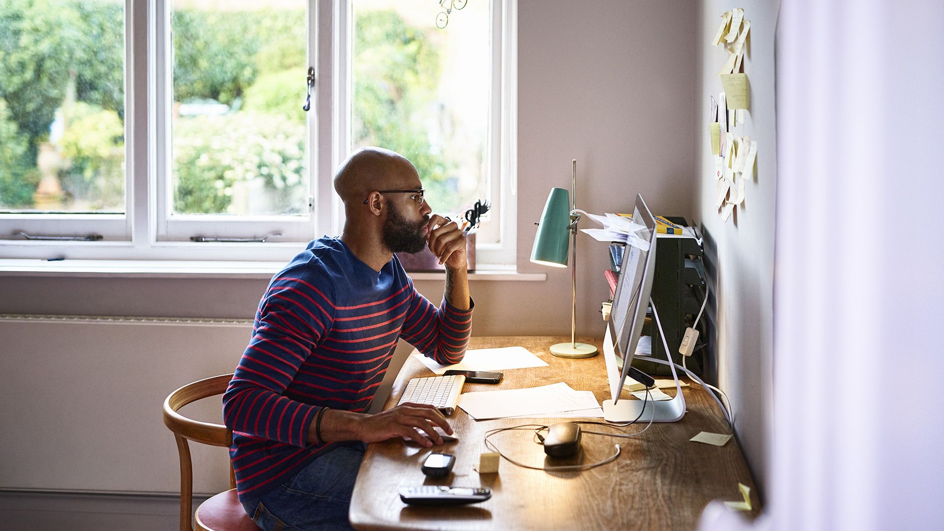 A person uses and MCP server to complete tasks while working from home a their desk.