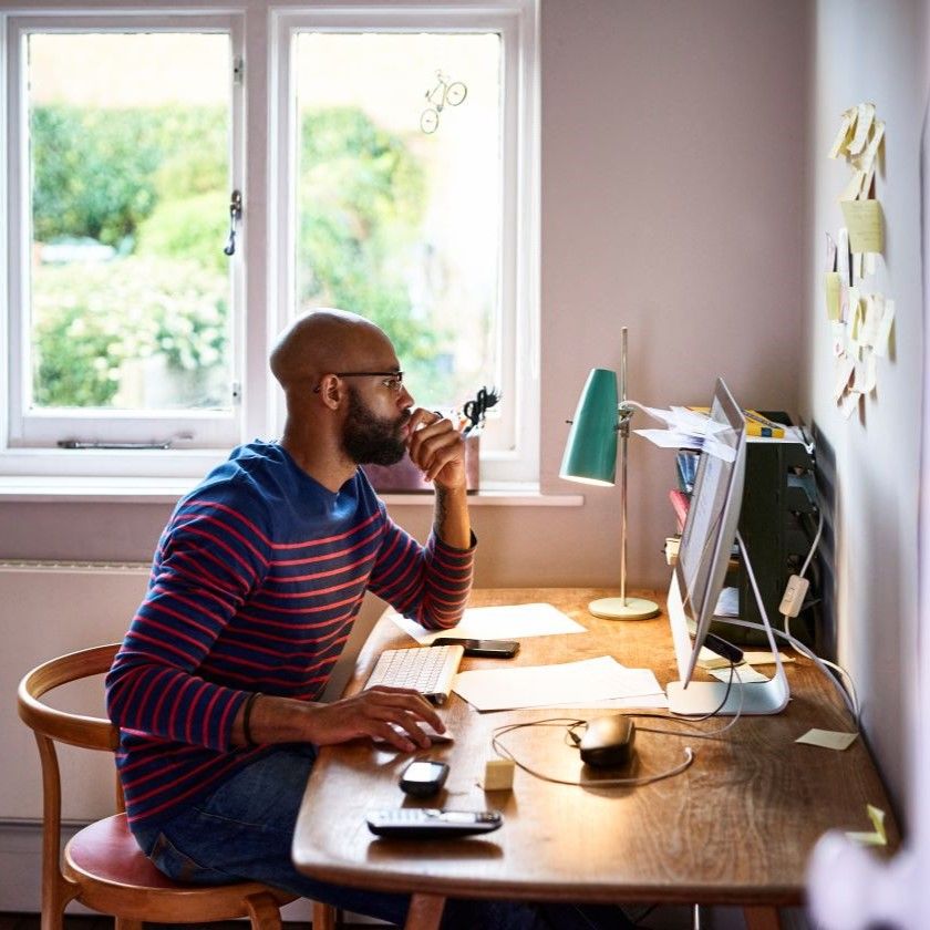 A person uses and MCP server to complete tasks while working from home a their desk.