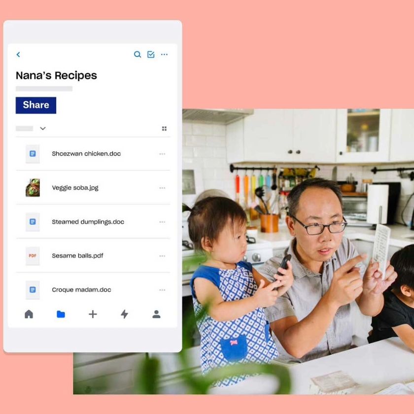 Father with two children looking at a folder of Nana's Recipes, stored in their Dropbox account.