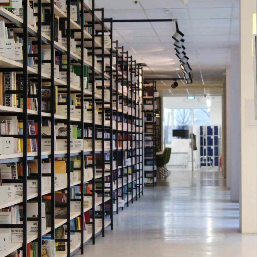 Shelves of records are neatly stacked and labeled clearly to ensure they are easy to manage.