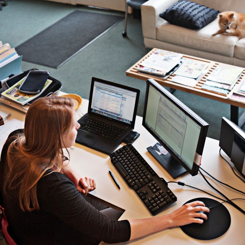 An office worker shares large files securely from her Dropbox account.