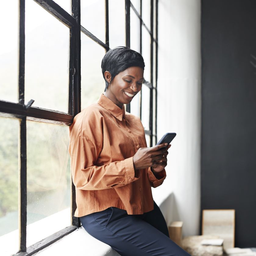 A solopreneur uses Dropbox to manage their business away from their desk.