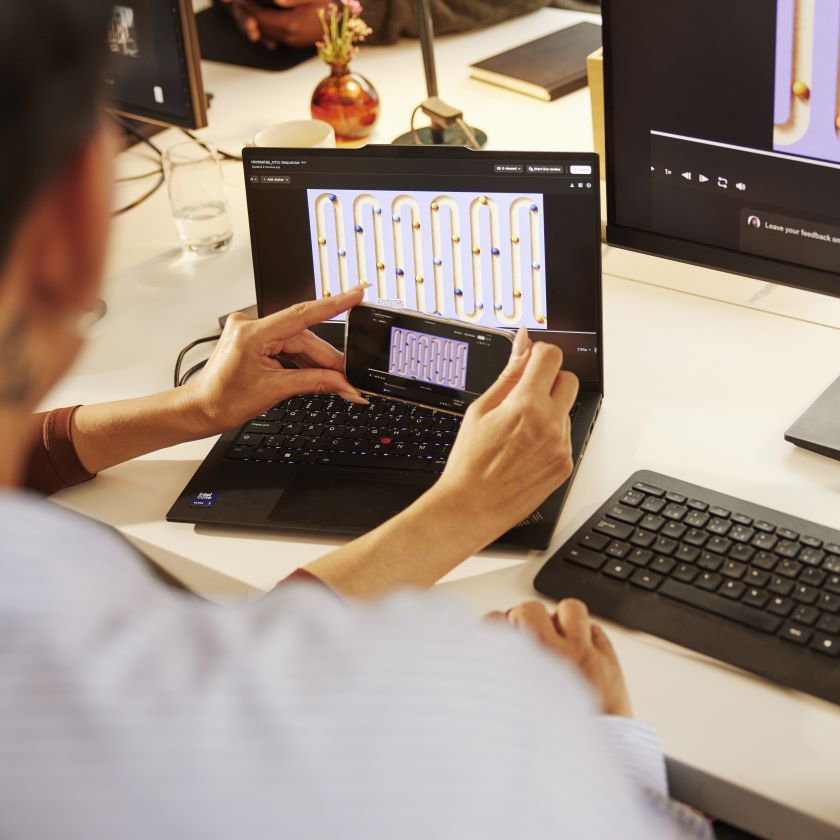 A team of creatives collaborate on a video project in a studio space.