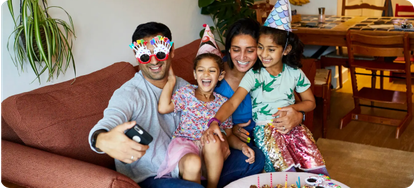 Family taking a photo at a birthday party